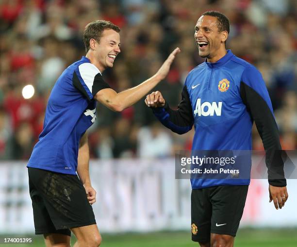 Jonny Evans and Rio Ferdinand of Manchester United in action during a first team training session as part of their pre-season tour of Bangkok,...