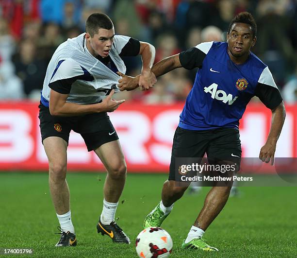 Michael Keane and Anderson of Manchester United in action during a first team training session as part of their pre-season tour of Bangkok,...