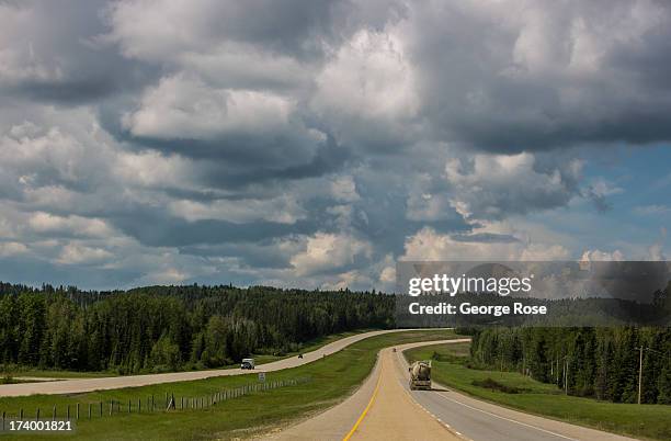 Clouds provide a dramatic backdrop along Highway 16 during the drive into Jasper National Park on June 24, 2013 near Hinton, Alberta, Canada. Jasper...