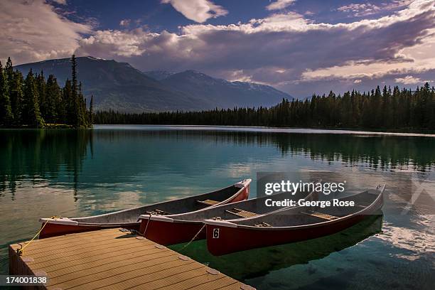 Canoes are ready to rent at the Beauvert Lake boathouse at the Fairmont Jasper Park Lodge on June 24, 2013 near Jasper, Alberta, Canada. Jasper is...