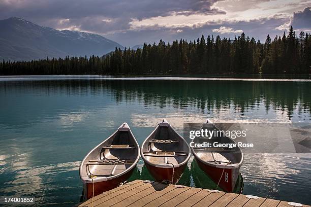 Canoes are ready to rent at the Beauvert Lake boathouse at the Fairmont Jasper Park Lodge on June 24, 2013 near Jasper, Alberta, Canada. Jasper is...