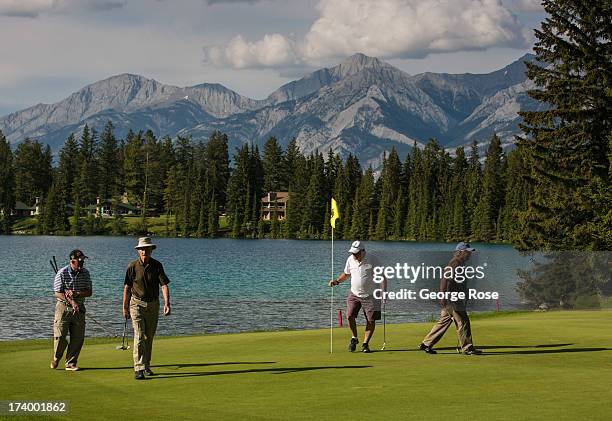 Golfers play a round at the Fairmont Jasper Park Lodge Golf Course on June 24, 2013 near Jasper, Alberta, Canada. Jasper is the largest National Park...