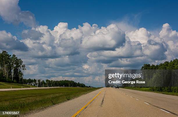 Clouds provide a dramatic backdrop along Highway 16 during the drive into Jasper National Park on June 24, 2013 near Hinton, Alberta, Canada. Jasper...