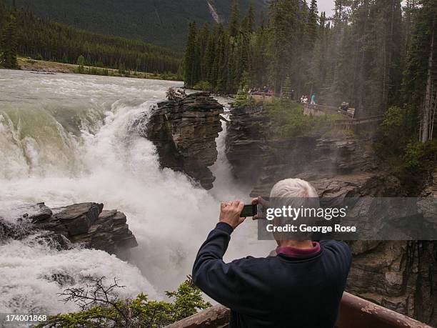 Athabasca Falls is running high and fast due to several powerful summer storms as viewed on June 25, 2013 near Jasper, Alberta, Canada. Jasper is the...