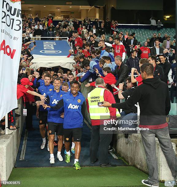 Anderson, Ryan Giggs and Michael Carrick of Manchester United lead the team out ahead of a first team training session as part of their pre-season...