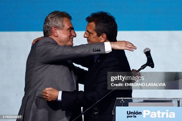 Argentine Economy Minister and presidential candidate for the Union por la Patria party, Sergio Massa , hugs his running mate Agustin Rossi after...