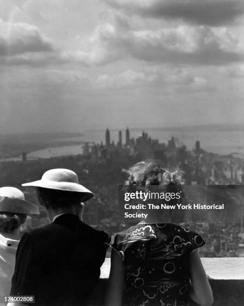 Women looking south from observation deck, Empire State Building, New York, New York, 1920s.