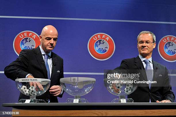 Gianni Infantino, UEFA General Secretary, and Giorgio Marchetti, UEFA Competition Director, proceed to the UEFA Champions League Q3 qualifying round...