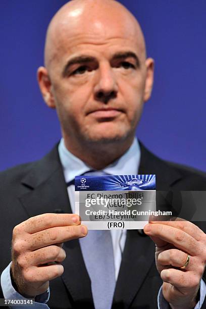 Gianni Infantino, UEFA General Secretary, shows the names FC Dinamo Tbilisi / EB/Streymur during the UEFA Champions League Q3 qualifying round draw...