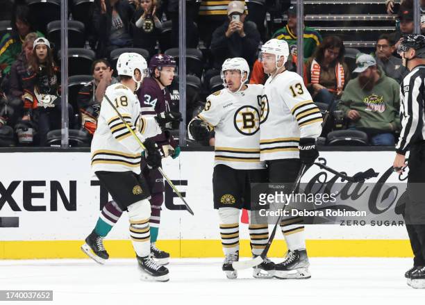 Brad Marchand of the Boston Bruins celebrates his third-period goal Pavel Zacha and Charlie Coyle during the game against the Anaheim Ducks at Honda...