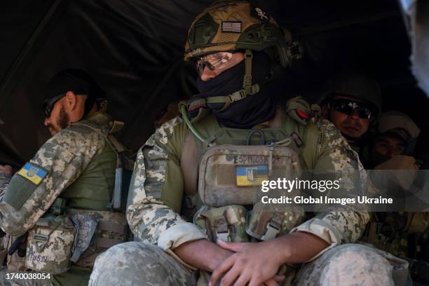 Military volunteers and foreign legionnaires, enlisted to fight in the Armed Forces of Ukraine, go to a kaolin quarry for target shooting practicing...