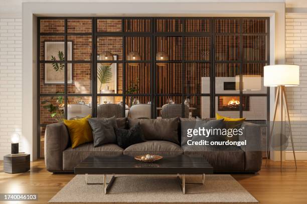 luxuriöses wohnzimmer bei nacht mit sofa, stehlampe und esszimmer - beautiful living room stock-fotos und bilder