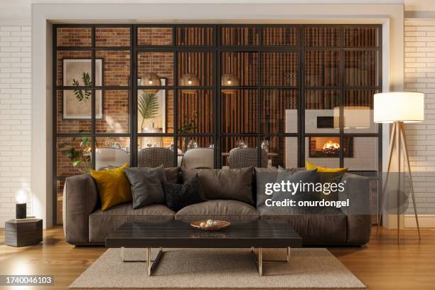luxury living room at night with sofa, floor lamp and dining room - low lighting stock pictures, royalty-free photos & images