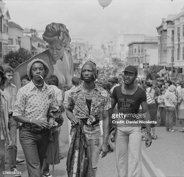 Revelers Leon Lott, December Wright, and Larry Williams at the Castro Street Fair, San Francisco, California, August 1976.