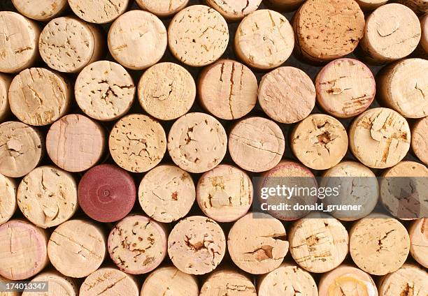 collection of corks with one red one that doesn't match - wine cork stock pictures, royalty-free photos & images