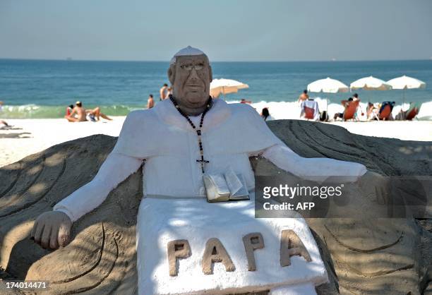 View of a sand statue depicting Pope Francis at Copacabana beach in Rio de Janeiro, Brazil on July 19, 2013. More than 1.5 million pilgrims from...