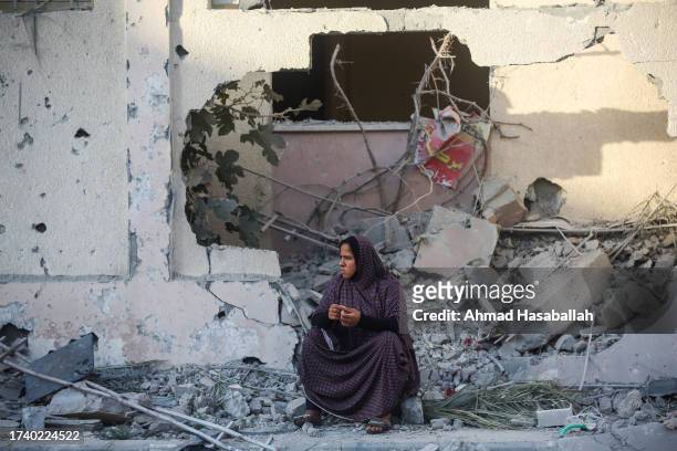 Palestinian citizen inspects their home destroyed during Israeli air raids in the southern Gaza Strip on October 17, 2023 in Khan Yunis, Gaza. Gazans...