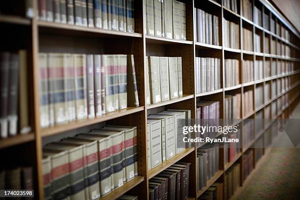 endless books on shelves at the library - enciclopedia stockfoto's en -beelden