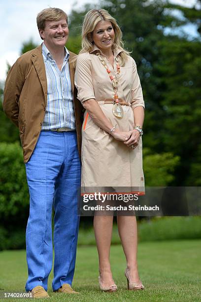 King Willem-Alexander of the Netherlands and Queen Maxima of the Netherlands pose during the annual summer photocall at Horsten Estate on July 19,...