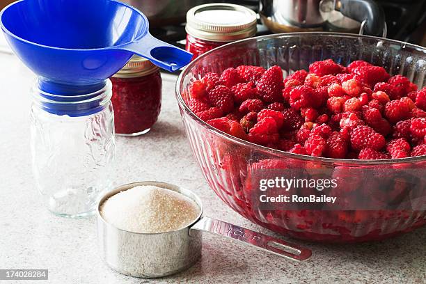 making raspberry jam - canning stock pictures, royalty-free photos & images