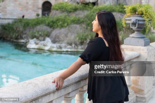 young south american girl on vacation in a park - south park stock pictures, royalty-free photos & images