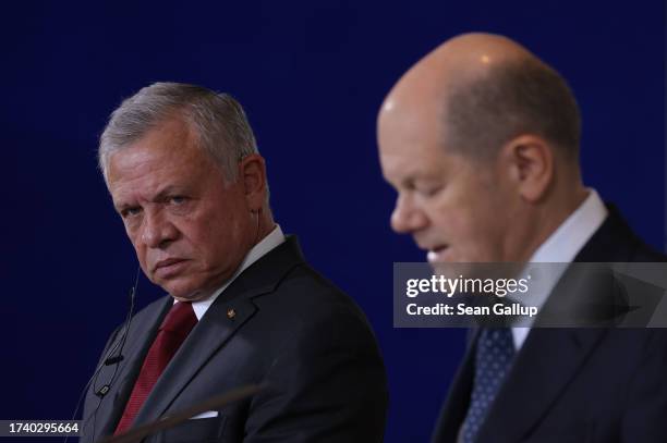 German Chancellor Olaf Scholz and Jordanian King Abdullah II speak to the media following talks at the Chancellery on October 17, 2023 in Berlin,...