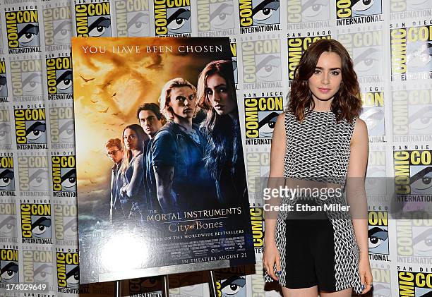 Actress Lily Collins attends "The Mortal Instruments: City of Bones" press line during Comic-Con International 2013 at the Hilton San Diego Bayfront...
