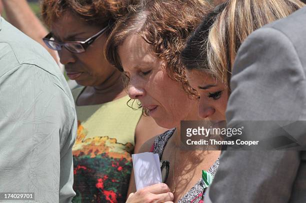 Jane Dougherty attends a remembrance ceremony at Cherry Creek State Park July 19, 2013 in Aurora, Colorado. Dougherty's sister, Mary Sherlach, was...