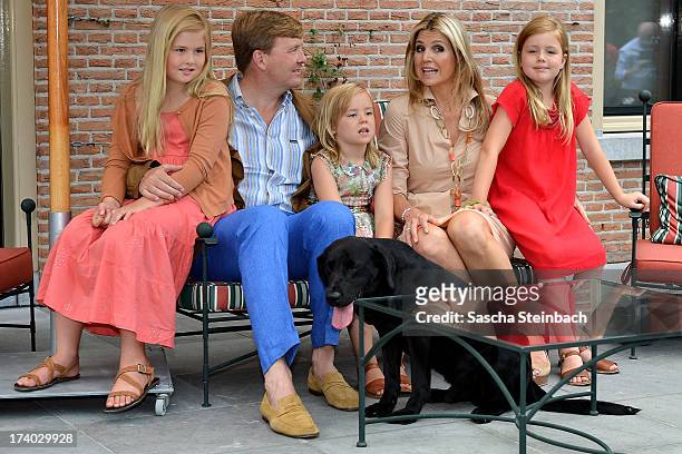 King Willem-Alexander, Queen Maxima, Princess Catharina-Amalia, Princess Alexia and Princess Ariane with their dog 'Skipper' pose during the annual...