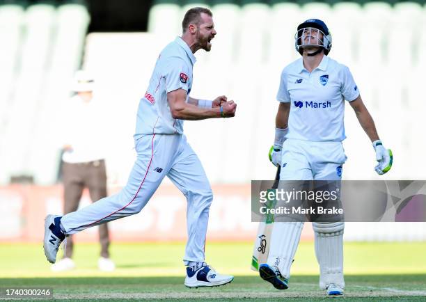 Nathan McAndrew of the Redbacks celebrates the wicket of Daniel Hughes of the Blues on thev second last ball of the day during the Sheffield Shield...