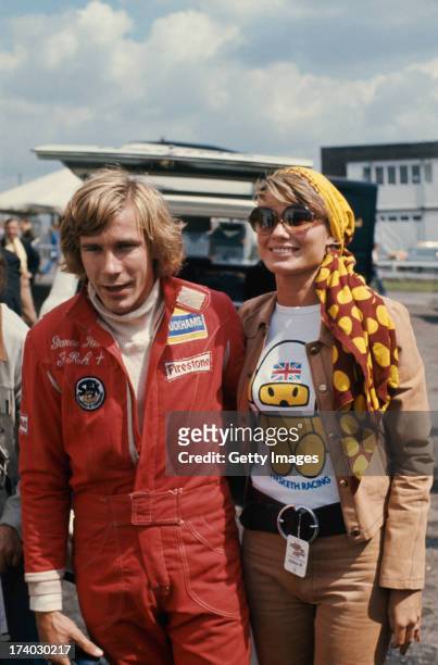 English racing driver James Hunt with his first wife, Suzy Miller, at the British Grand Prix, Brands Hatch, 20th July 1974.