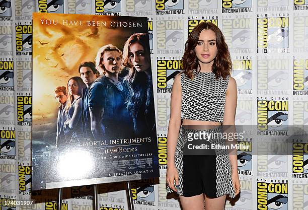 Actress Lily Collins attends "The Mortal Instruments: City of Bones" press line during Comic-Con International 2013 at the Hilton San Diego Bayfront...