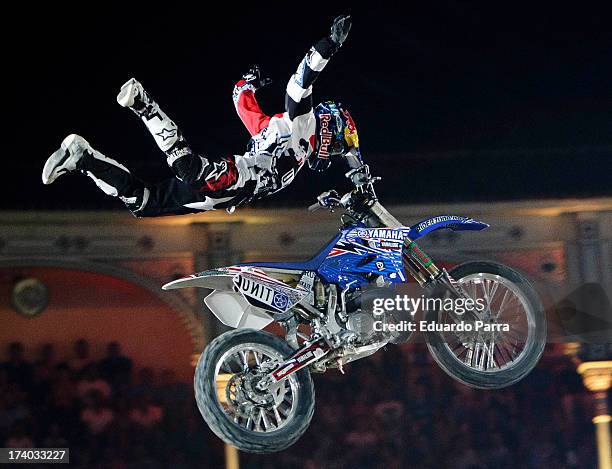 Freestyle motorcycle rider Tom Pages performs a maneuver during the Red Bull X-Fighters 2013 practice ride at Las Ventas bullring on July 19, 2013 in...