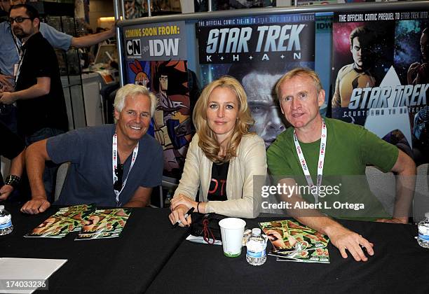 Producer Chris Carter, actress Gillian Anderson and actor Dean Haglund sign autographs during Comic-Con International at San Diego Convention Center...