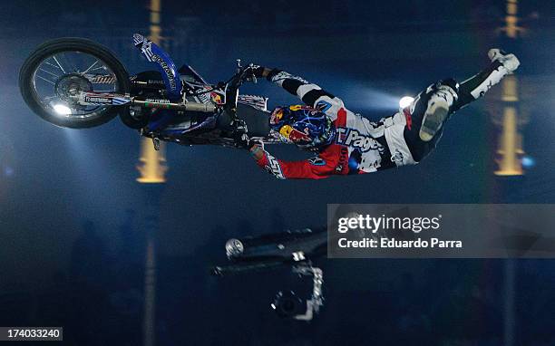 Freestyle motorcycle rider Tom Pages performs a maneuver during the Red Bull X-Fighters 2013 practice ride at Las Ventas bullring on July 19, 2013 in...