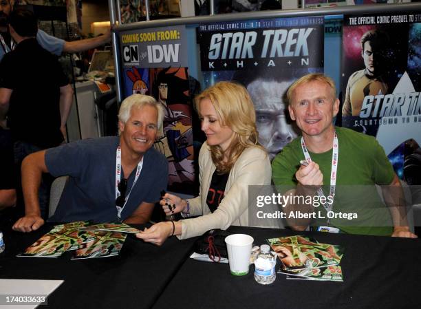 Producer Chris Carter, actress Gillian Anderson and actor Dean Haglund sign autographs during Comic-Con International at San Diego Convention Center...