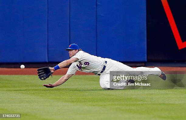 Kirk Nieuwenhuis of the New York Mets can't come up with a ball hit for a third inning double by Darin Ruf of the Philadelphia Phillies at Citi Field...