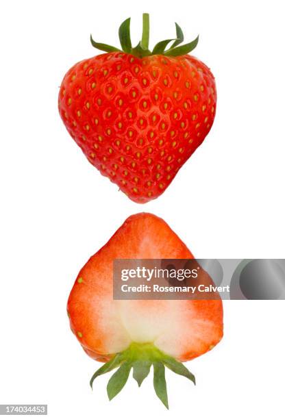 two halves of fresh, ripe strawberry - juicy strawberry stock pictures, royalty-free photos & images