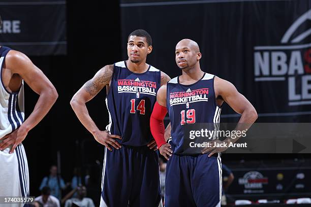 Glen Rice, Jr and Sundiata Gaines of the Washington Wizards look on versus the New Orleans Pelicans during NBA Summer League on July 19, 2013 at the...