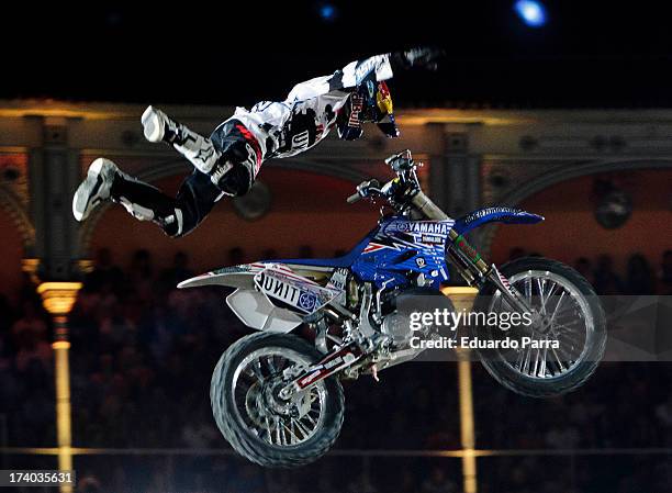 Freestyle motorcycle rider Tom Pages performs a maneuver during the Red Bull X-Fighters 2013 practice ride at Las Ventas bullring on July 19, 2013 in...