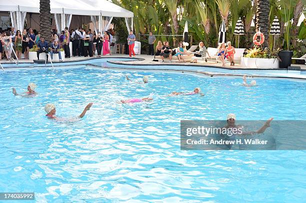 View of Synchronized swimming at the Esther Williams cocktail reception during Mercedes-Benz Fashion Week Swim 2014 at The Raleigh on July 19, 2013...