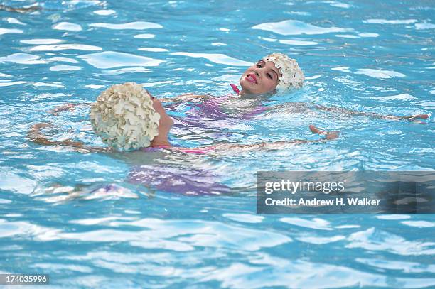 View of Synchronized swimming at the Esther Williams cocktail reception during Mercedes-Benz Fashion Week Swim 2014 at The Raleigh on July 19, 2013...