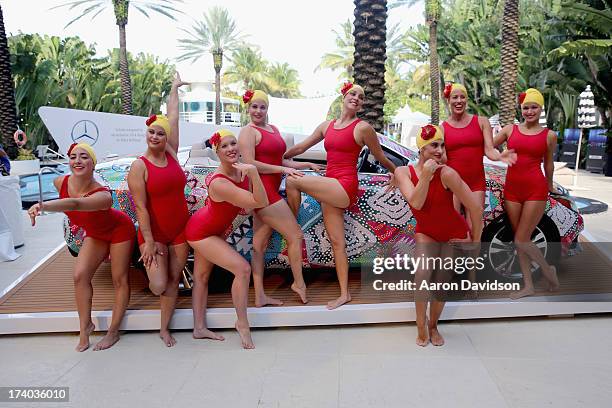 View of synchronized swimming at the Esther Williams cocktail reception during Mercedes-Benz Fashion Week Swim 2014 at The Raleigh on July 19, 2013...