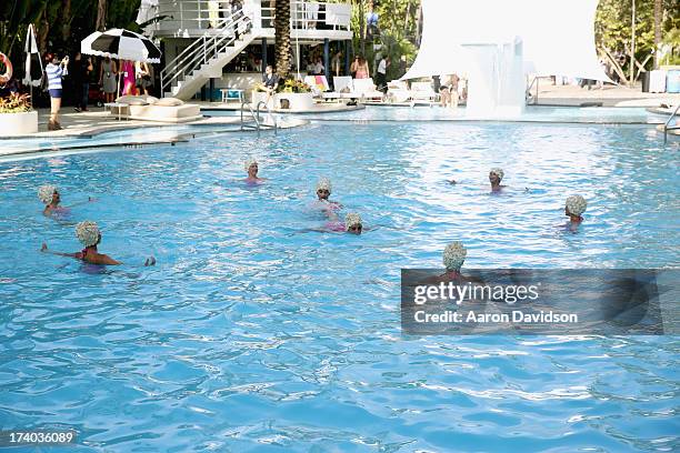 View of synchronized swimming at the Esther Williams cocktail reception during Mercedes-Benz Fashion Week Swim 2014 at The Raleigh on July 19, 2013...