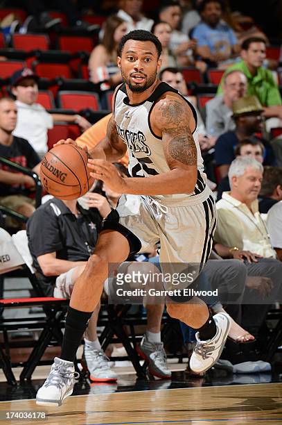 Xavier Silas of the Milwaukee Bucks dribbles to the basket versus the San Antonio Spurs during NBA Summer League on July 19, 2013 at the Cox Pavilion...