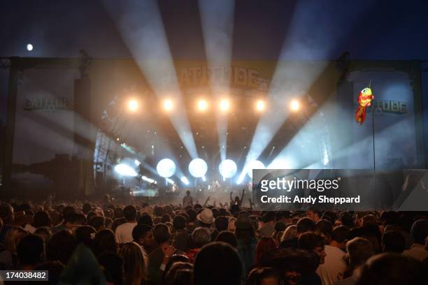 Crowd of festival music fans enjoy the performance and atmosphere during Day 2 of Latitude Festival 2013 at Henham Park Estate on July 19, 2013 in...