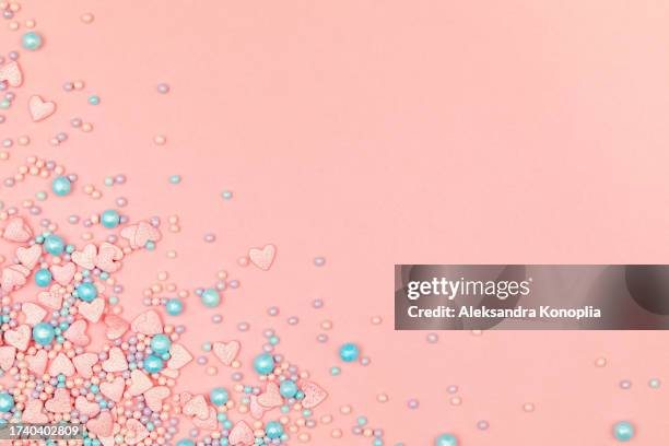 trendy pastel pink kawaii background with border of cute pink and blue heart shaped sweets and sprinkles. top view, flat lay, copy space. candycore, toycore. - photo album corners stock pictures, royalty-free photos & images