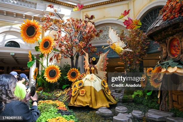 Tourists enjoy at Autumn and Halloween decorated lobby in Bellagio Hotel of Las Vegas in Nevada, United States on October 1, 2023.