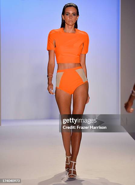 Model walks the runway at the Suboo show during Mercedes-Benz Fashion Week Swim 2014 at Oasis at the Raleigh on July 19, 2013 in Miami, Florida.