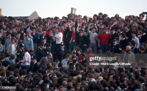 October 1979 - Football League Division One - Crystal Palace v Tottenham Hotspur - A gap opens on the Selhurst Park terraces as police officers move...